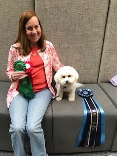 Susan Keller with dog and ribbons